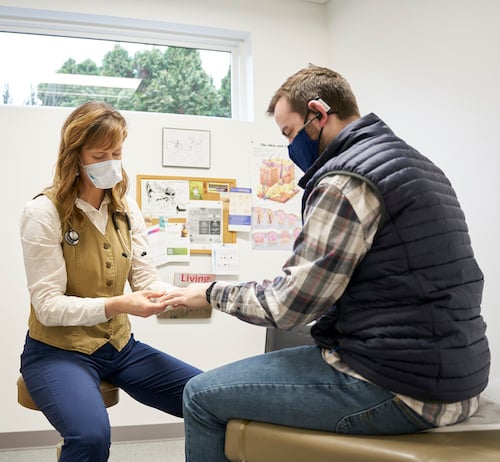 Kirstin Curtis ARNP with patient small Kirstin Curtis ARNP with patient small