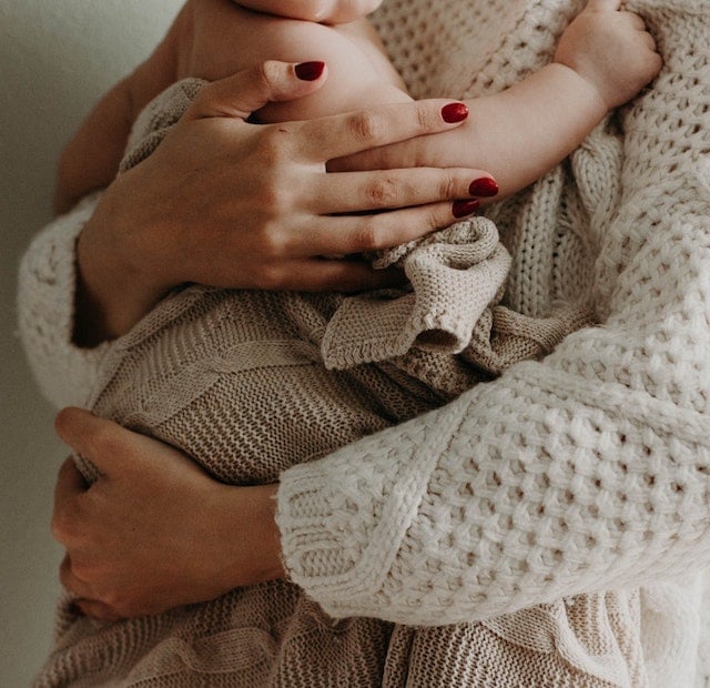 mother holding her baby mother holding her baby
